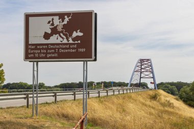 Domtiz, Germany - August 2, 2022: Memorial sign and bridge along the former inner-German border in Domitz in Germany in remembrance of the German devision in East and West Germany