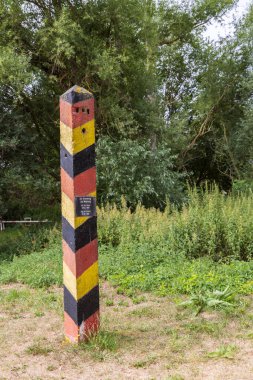 Schlagsdorf , Germany - July 31, 2022: Old border pole at Grenzhus museum in Schlagsdorf in Germany telling the story of the iron curtain between former East and West Germany during the cold war