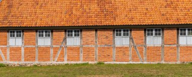 Half-timbered house background with windows and doors