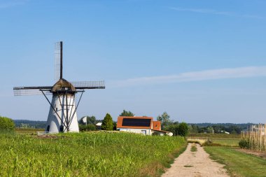 White polder mill De March from 1885 in Lienden Municipality of Buren in Gelderland The Netherlands clipart