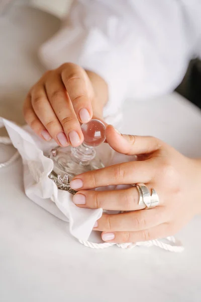 Close Female Hands Holding Transparent Perfume Bottle White Background — Stock Photo, Image