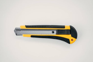 Repair tools, screwdriver, stationery knife, pliers on a white background