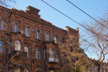 Odessa, Ukraine - 04 22 21: vintage yellow red brick facade in the city center. Early sprig photo