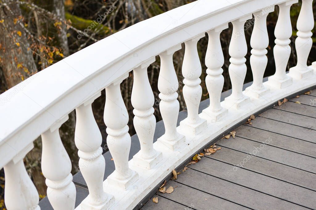 Unique royal style antique park white architecture handrail railling. Photo taken in overcast day - autumn.
