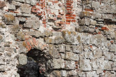 Close up photo of old architecture, building brick, rock details. Photo taken on a warm overcast autumn day.
