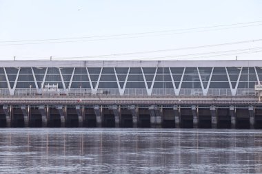 Close up photo of industrial water electricity factory building. Photo taken on a warm overcast autumn day.