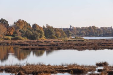 Beatufiul nature landscape view of lovely river with yello, orange colors. Photo taken on october.