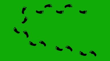 Çıplak ayakların siyah siluetinin döngüsü ayak izlerini bırakır.