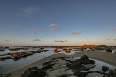 Sunset over rocky shelf at Norah Head, NSW Australia