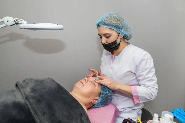 Beautiful Adult Woman Enjoying Facial Massage Spa Relaxing Medical Treatment — стоковое фото