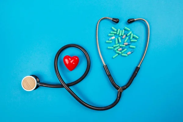 Medical Stethoscope Red Heart Pills Blue Background — Stock Photo, Image