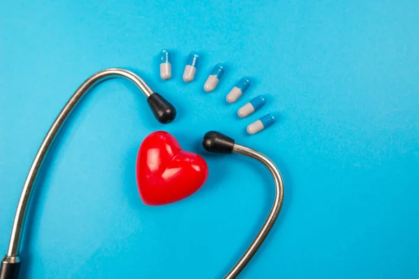 Medical Stethoscope Red Heart Pills Blue Background — Stock Photo, Image