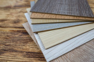 wooden premium sampler for design of modern apartments.Laminate background. Samples of laminate or parquet with a pattern and wood texture for flooring and interior design. Production of wooden floors