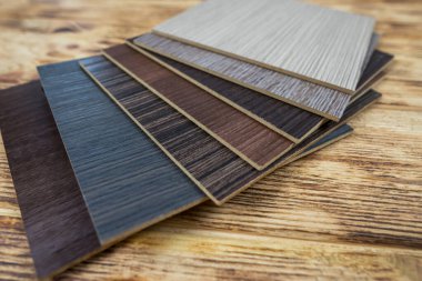 wooden premium sampler for design of modern apartments.Laminate background. Samples of laminate or parquet with a pattern and wood texture for flooring and interior design. Production of wooden floors