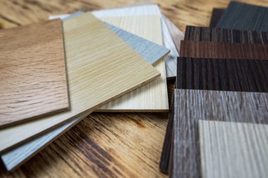 wooden premium sampler for design of modern apartments.Laminate background. Samples of laminate or parquet with a pattern and wood texture for flooring and interior design. Production of wooden floors