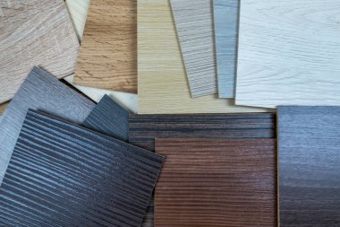 wooden premium sampler for design of modern apartments.Laminate background. Samples of laminate or parquet with a pattern and wood texture for flooring and interior design. Production of wooden floors
