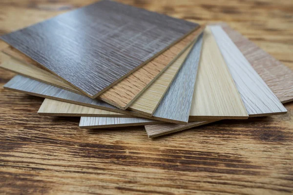 wooden premium sampler for design of modern apartments.Laminate background. Samples of laminate or parquet with a pattern and wood texture for flooring and interior design. Production of wooden floors