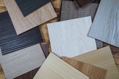 wooden premium sampler for design of modern apartments.Laminate background. Samples of laminate or parquet with a pattern and wood texture for flooring and interior design. Production of wooden floors