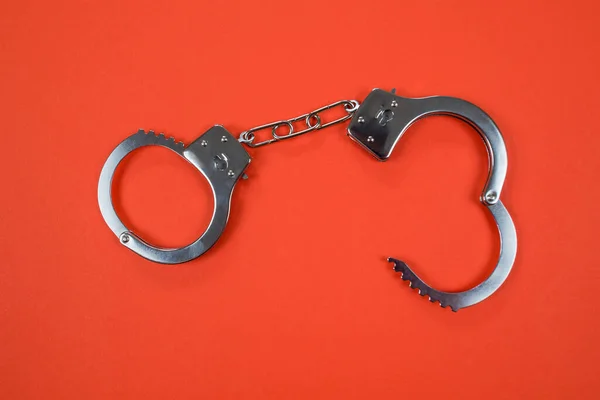 Metal Handcuffs Orange Background — Stock Photo, Image