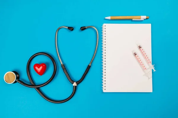 Top View Red Heart Stethoscope Pill Notepad Isolated Blue Background — Stock Photo, Image