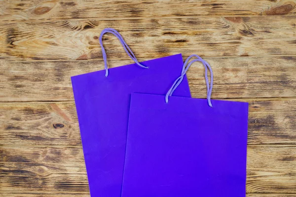 Two Blue Shopper Bags Wooden Background Shopping Concept — Zdjęcie stockowe