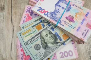 dollars and hryvnia banknotes.The ratio of the hryvnia to the dollar. Exchange rates.