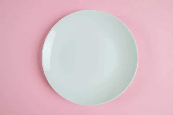 Top View Photo White Plate Isolated Pastel Pink Background — Stok fotoğraf
