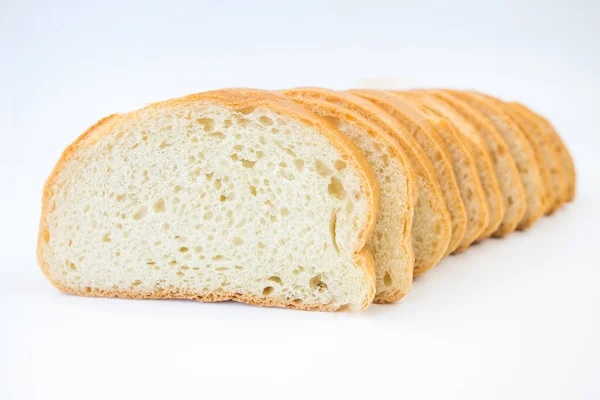 Krájený Bochník Chleba Bílém Pozadí — Stock fotografie