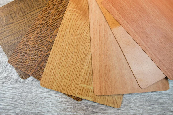Variety of wooden like tiles. Samples of fake wood tiles for