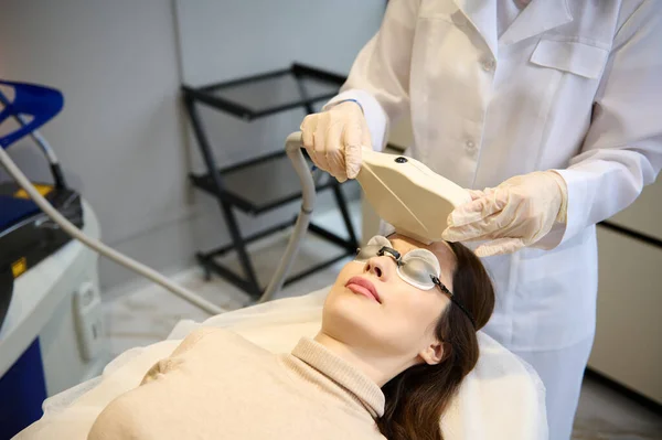 Close Caucasian Middle Aged Woman Getting Professional Facial Laser Treatment — стокове фото