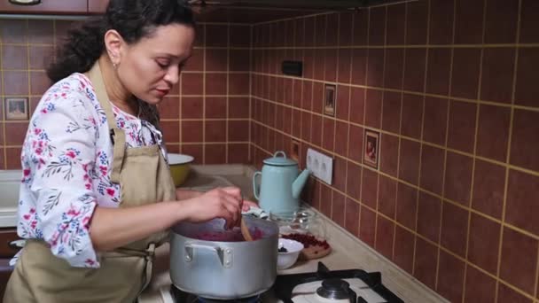 Beautiful Woman Housewife Stands Kitchen Stove Using Wooden Spatula Stirs — Vídeo de Stock
