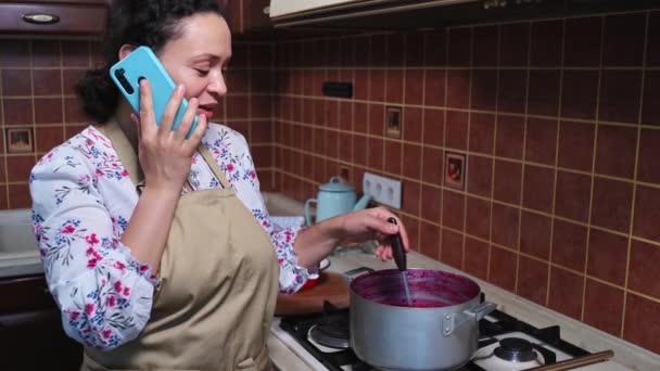 Inspired Woman Wearing Apron Housewife Talking Mobile Phone While Standing — Stock Video