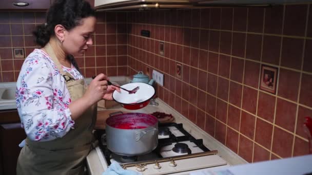Housewife Serene Multiethnic Woman Chef Pastry Using Spoon Scoops Froth — Stockvideo