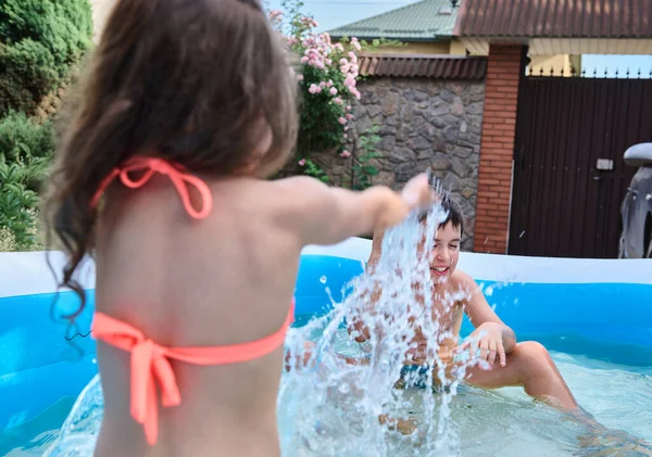 Photo Motion View Back Little Girl Splashing Water While Playing — Zdjęcie stockowe