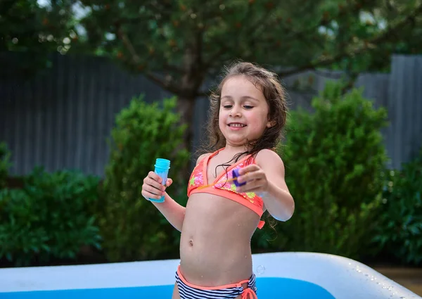 Adorable European Little Girl Wearing Bright Trendy Swimsuit Having Fun — Zdjęcie stockowe