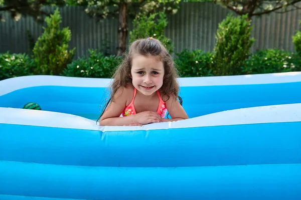 Cheerful Adorable Caucasian Child Cute Baby Girl Swims Inflatable Water Royalty Free Stock Photos