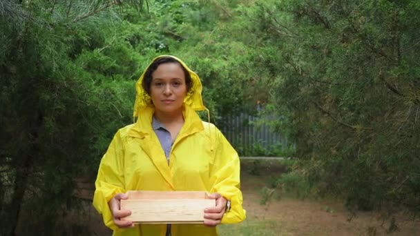 Young Delightful Prosperous Multiethnic Female Gardener Agriculturist Holding Wooden Crate — Stockvideo