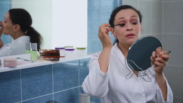 Stunning Multi Ethnic Woman White Bathrobe Reflecting Bathroom Mirror Applying — Αρχείο Βίντεο