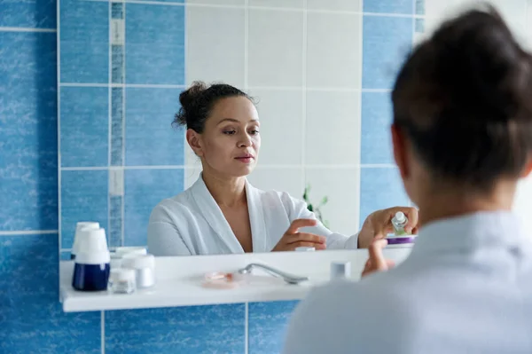 Charming Middle Aged Dark Haired Woman White Bathrobe Reflected Mirror — Foto de Stock