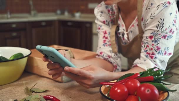 Soft Focus Smartphone Hands Woman Housewife Wearing Chefs Apron Looking — Stok video