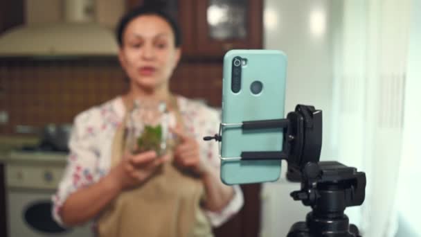 Changing Focus Smartphone Tripod Multiethnic Pretty Woman Pleasant Housewife Successful — Vídeos de Stock