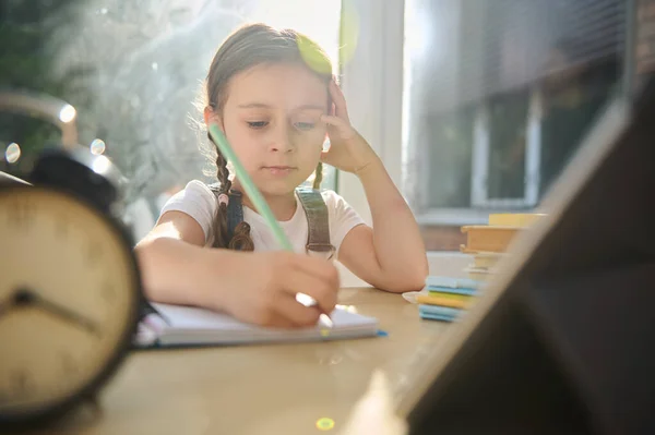 View Blurred Alarm Clock Tablet Schoolgirl First Grader Learning Writing — Foto de Stock