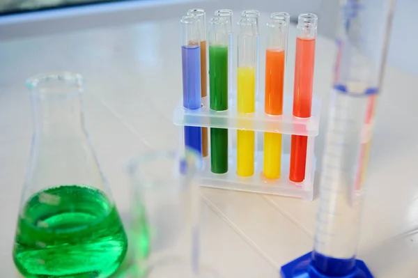 Close Test Tubes Colorful Chemical Liquids Tripod Blurred Flat Bottomed — ストック写真