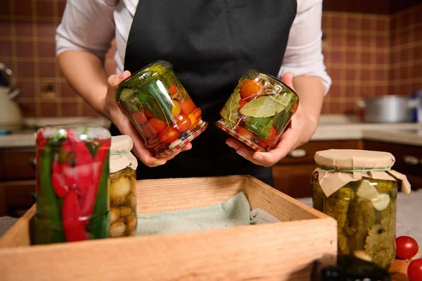 Close Housewife Holding Cans Freshly Canned Organic Homegrown Cherry Tomatoes — Zdjęcie stockowe