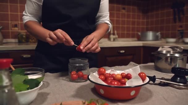 Pleasant Young Woman Housewife Chefs Cap Apron Putting Cherry Tomato — Stock video
