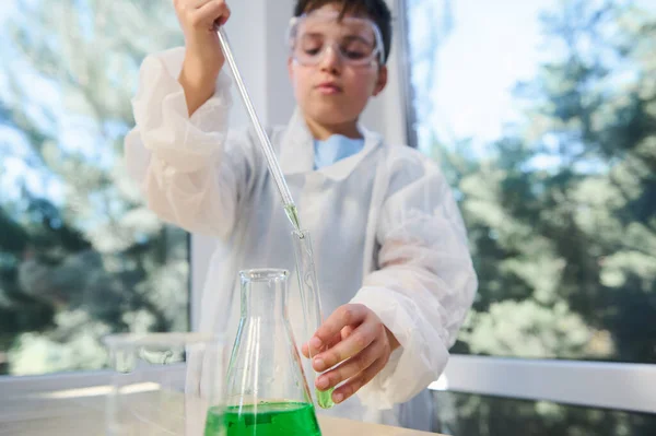 Details Hands Schoolboy Holding Glass Pipette Dripping Few Drops Green — Stock Fotó