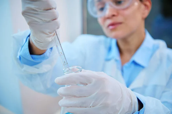 Focus Glass Laboratory Pipette Gloved Hands Blurred Female Pharmacologist Medical — Foto de Stock
