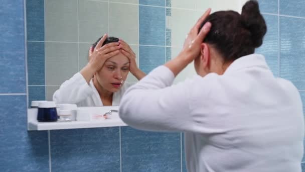 Charming Dark Haired Latin American Woman White Bathrobe Cleaning Her — Stock videók