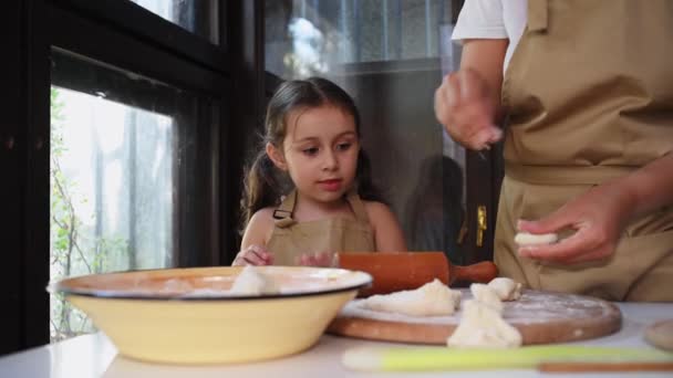 Beautiful European Little Girl Beige Chef Apron Stands Next Her — стоковое видео