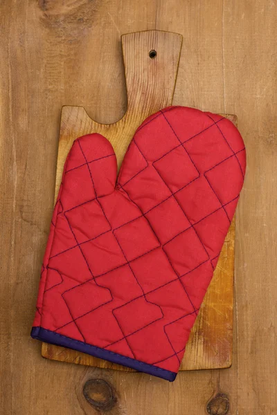 Potholder on a wooden background — Stock Photo, Image